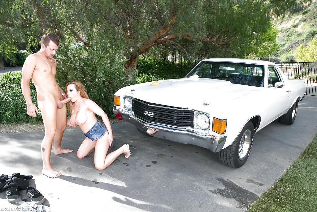 16P Corinna Blake sucks a gigantic cock on the hood of a white car