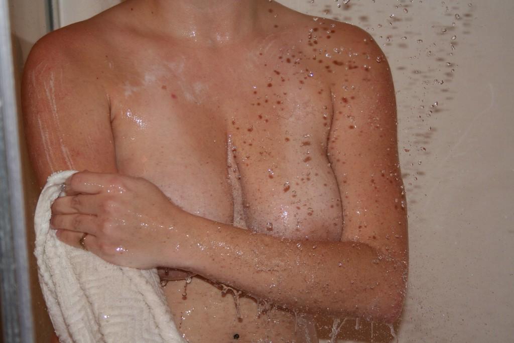 14P Pictures of teen amateur Busty Barbi getting all wet for you