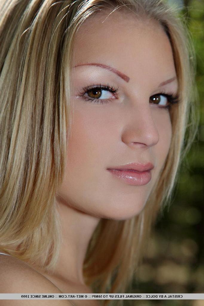 18P Pictures of teen beauty Cristal A slipping out of her lingerie in the woods