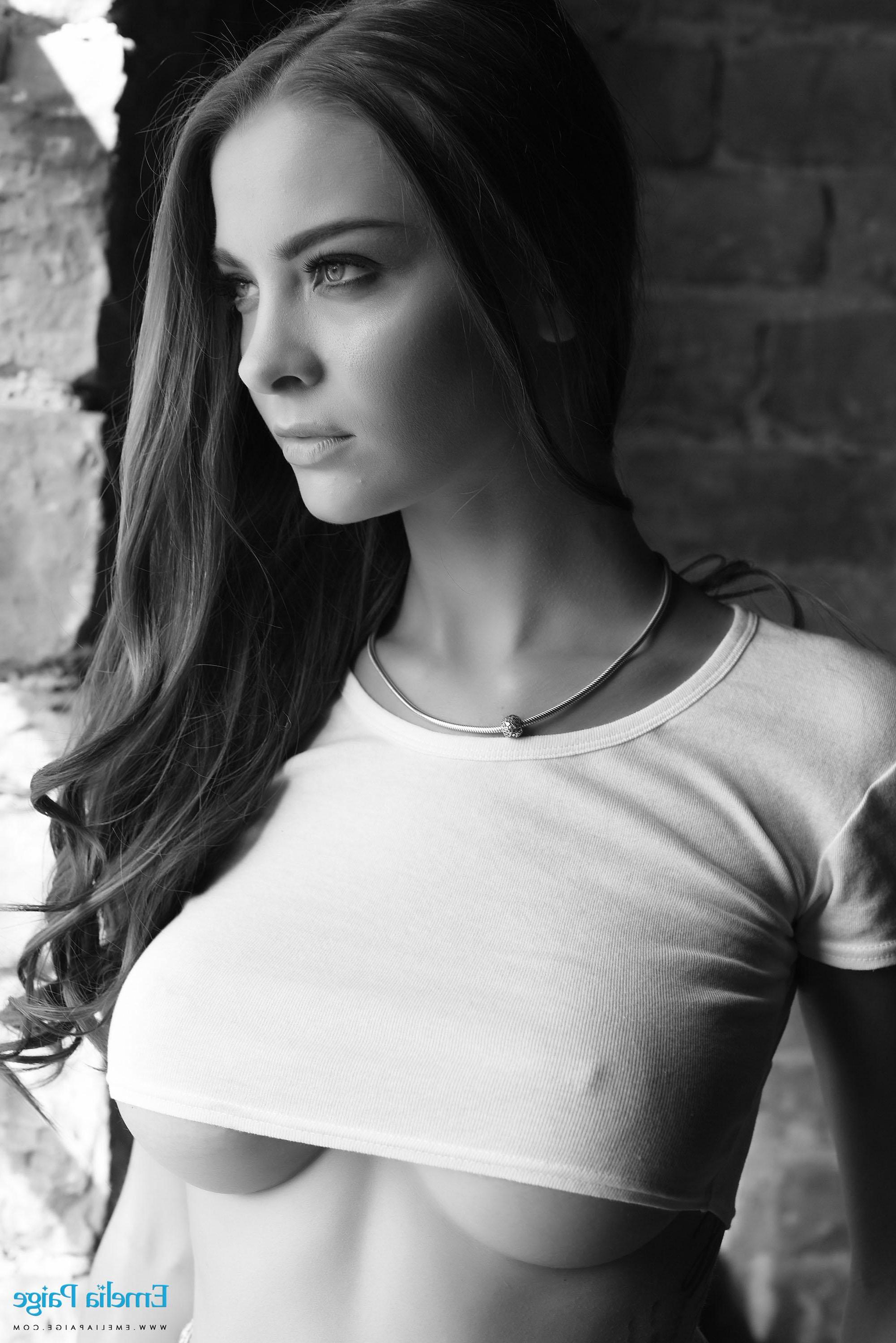 16P Emelia Paige removes her top to reveal her big boobs in black and white
