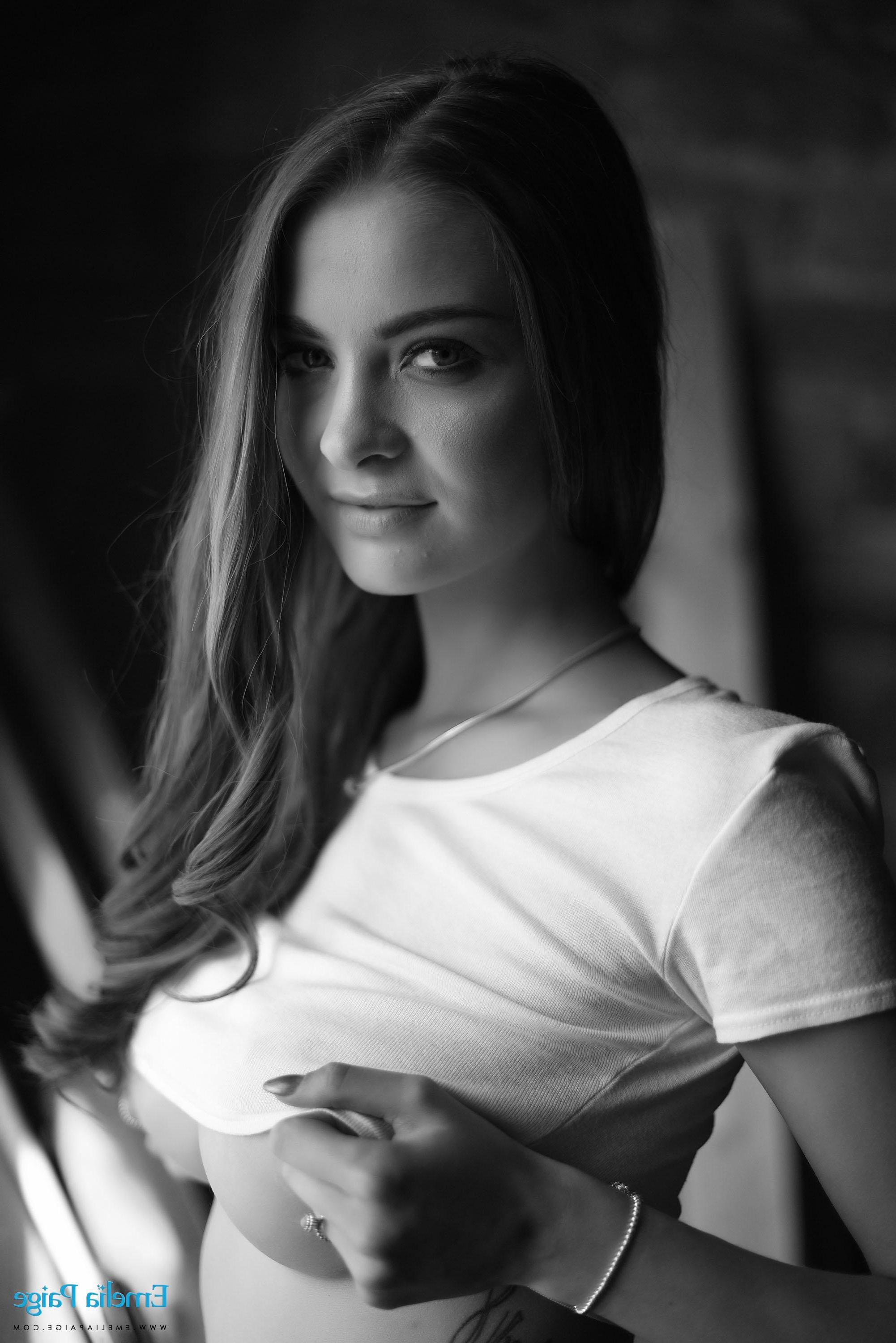16P Emelia Paige removes her top to reveal her big boobs in black and white