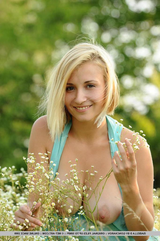 18P Busty blonde hottie Isabella D displays her huge breasts outside