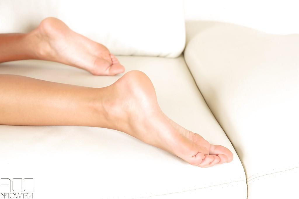 16P Leggy Euro chick Melena Maria frees barefeet from shoes and ass from shorts