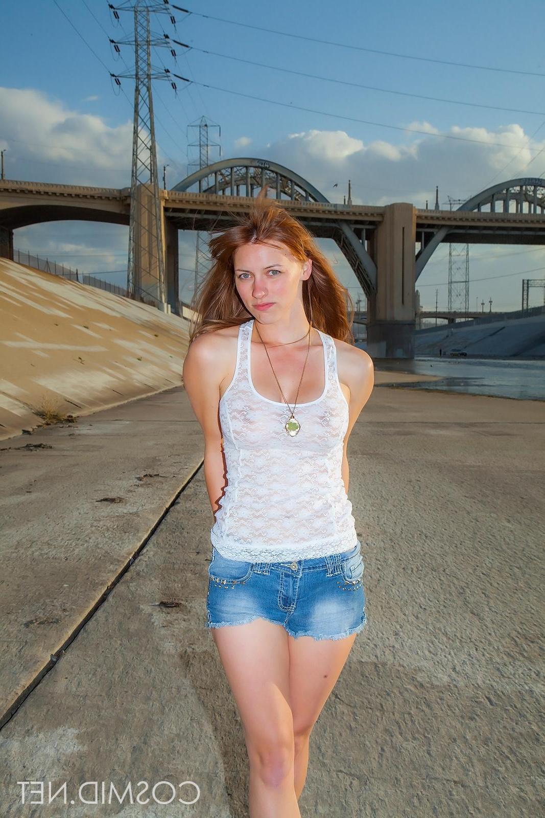 16P Busty redhead Jessica Fisher strips completely naked in the La River