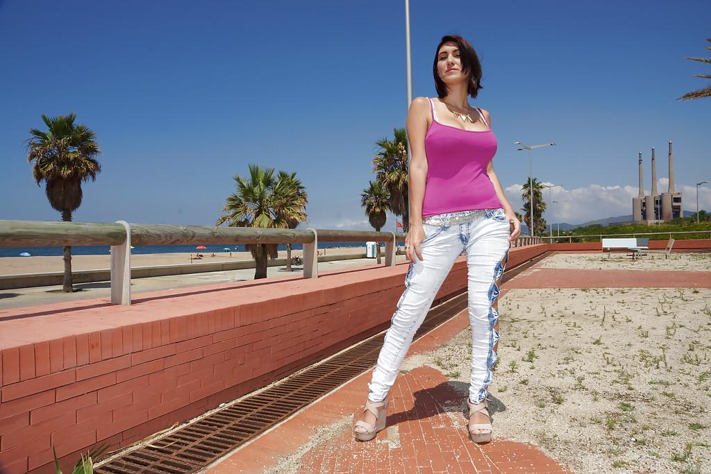 16P Valeria Blue demonstrates her big boobies while walking on the beach