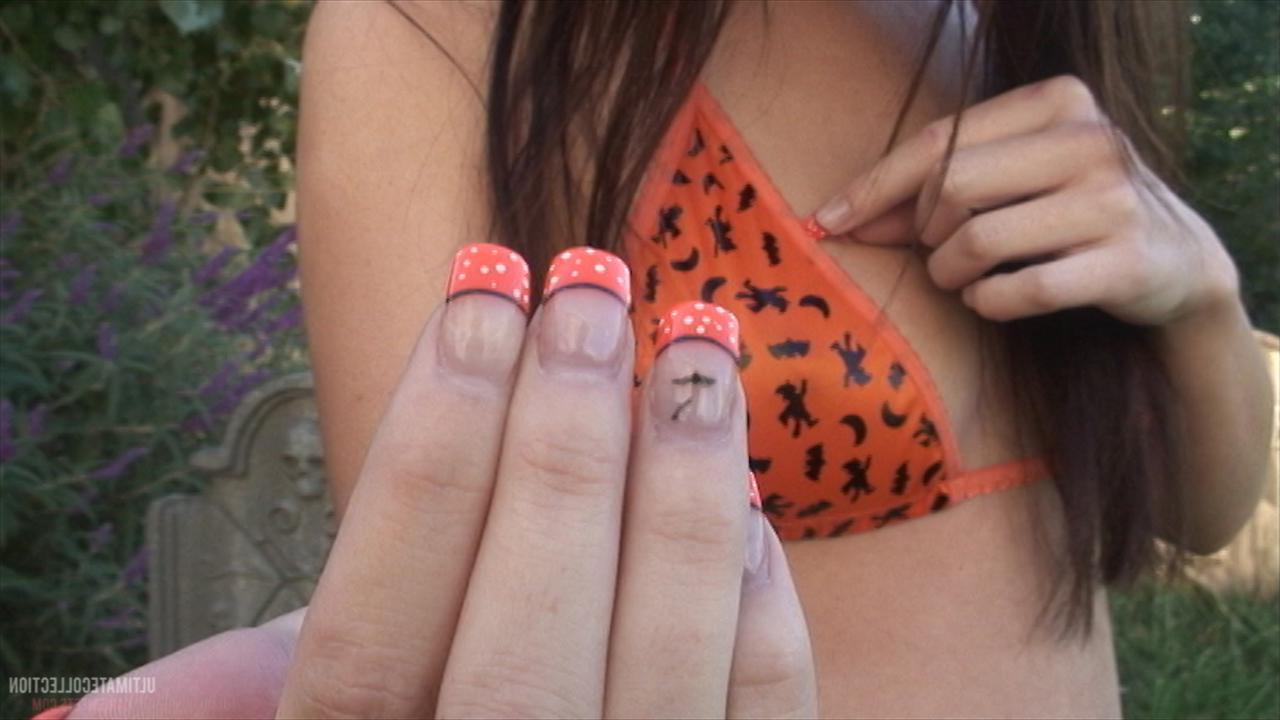 16P Brunette teen Kari Sweets teases in a cemetary for Halloween