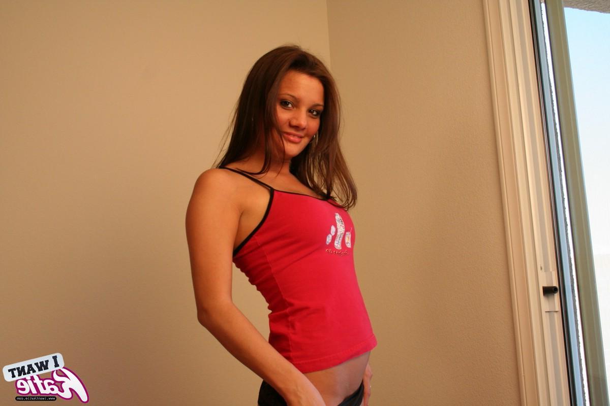 12P Busty teen Katie shows off her tight teen pussy as she strips naked for the camera