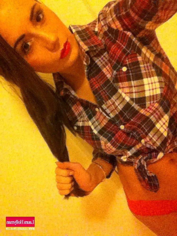 12P Laura Hollyman pulls off her checked shirt to expose her big round boobies