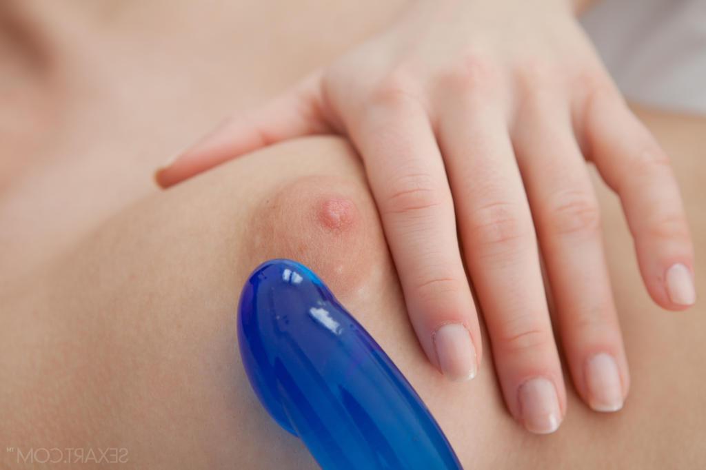 12P Caprice slowly removes her sheer blue lingerie before reaching for her glass dildo