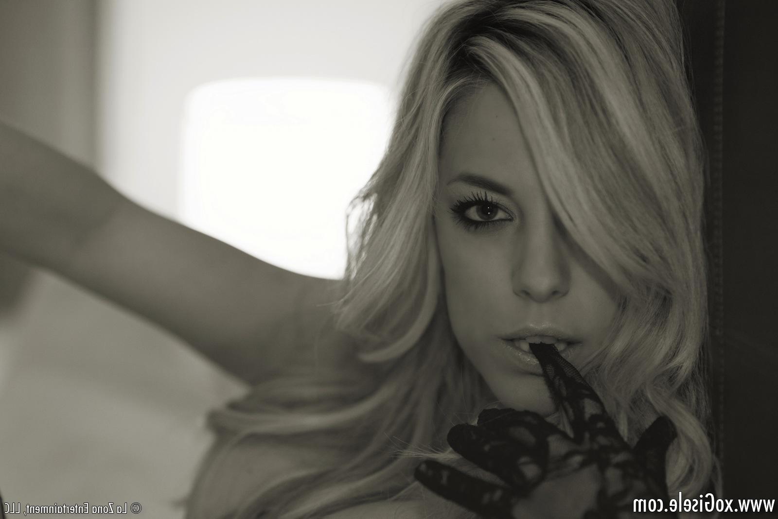 15P xoGisele shoots a sexy boudoir set with a tight corset and black fishnets