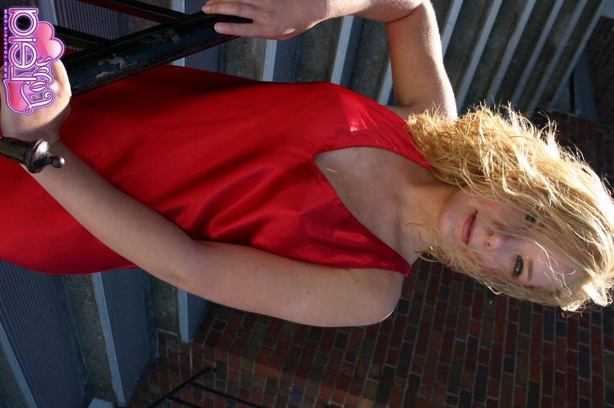 20P Pictures of teen Love Leia showing off her long legs in a red dress