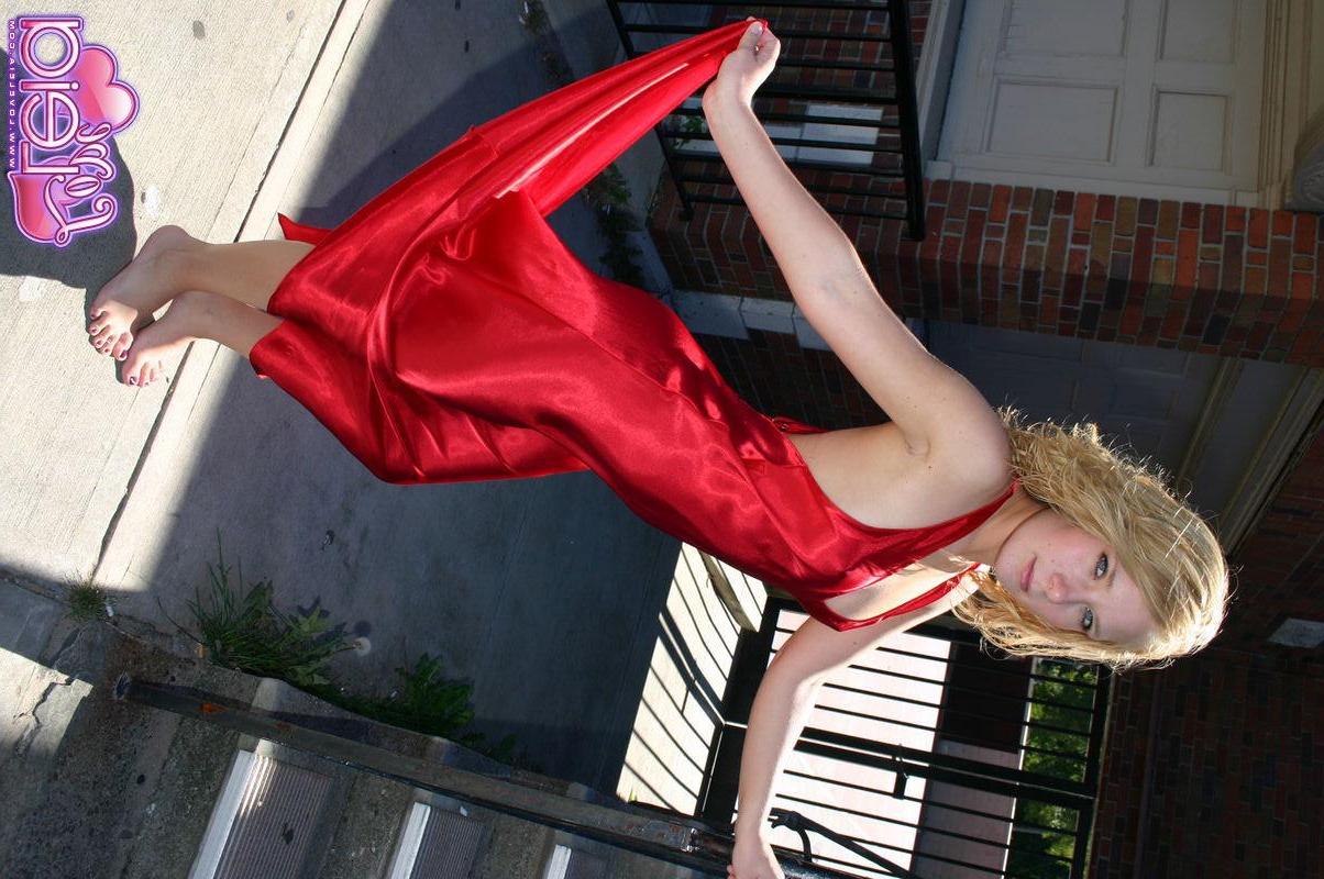 20P Pictures of teen Love Leia showing off her long legs in a red dress