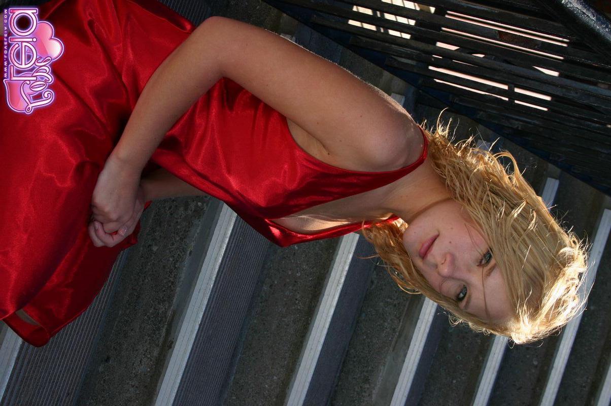 20P Pictures of teen Love Leia showing off her long legs in a red dress