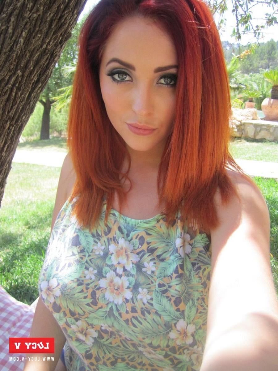 12P Beautiful redhead Lucy V strips her floral top to show you her big boobies