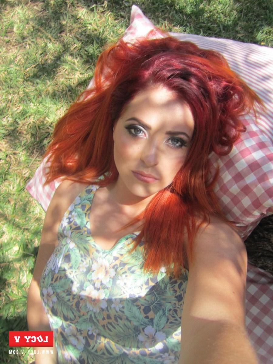 12P Beautiful redhead Lucy V strips her floral top to show you her big boobies
