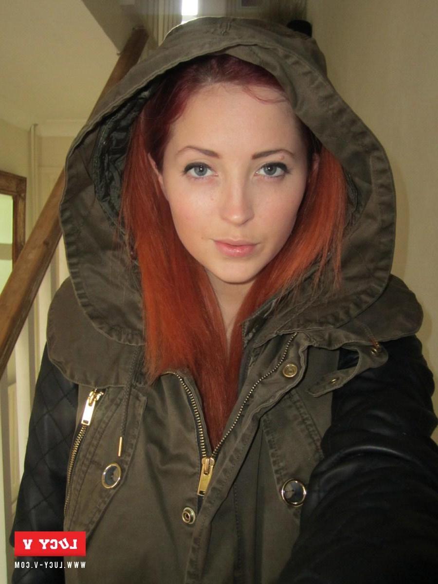 12P Lucy V strips from her winter jacket on the stairs