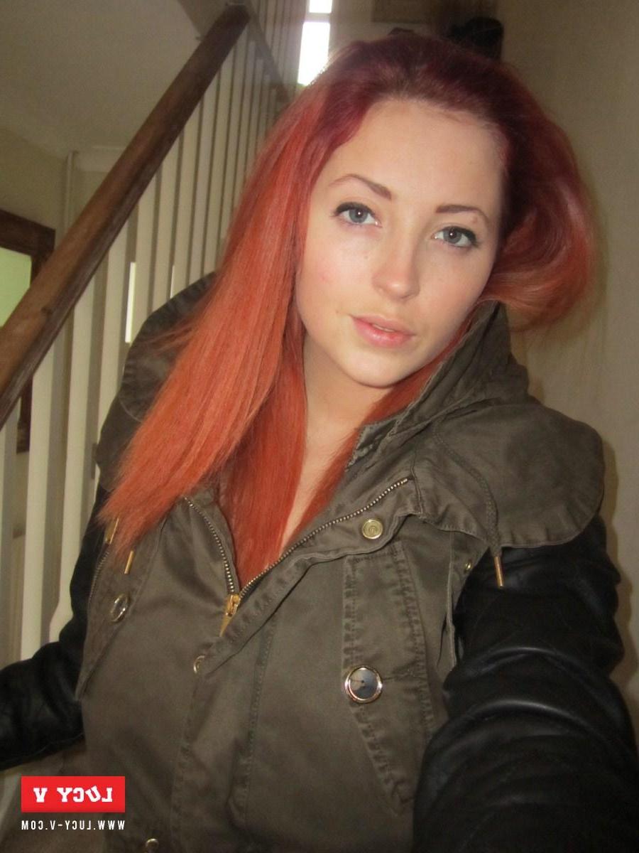 12P Lucy V strips from her winter jacket on the stairs