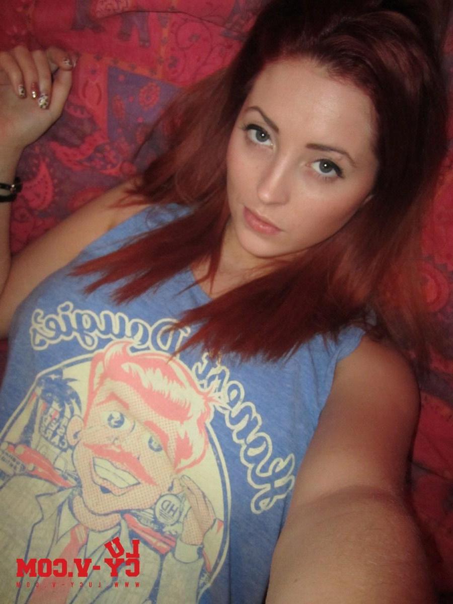 12P Pictures of redhead teen Lucy V looking hot as she takes off her blue top