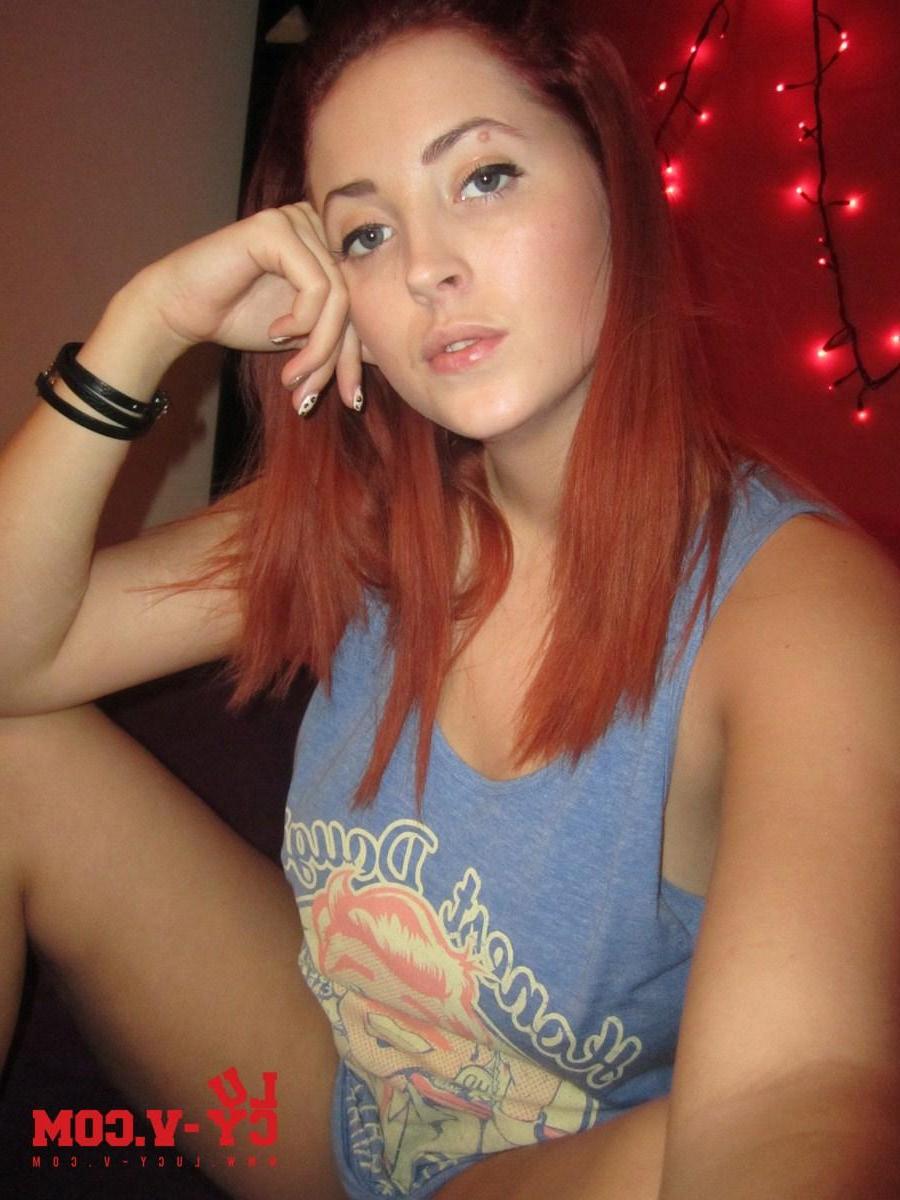 12P Pictures of redhead teen Lucy V looking hot as she takes off her blue top