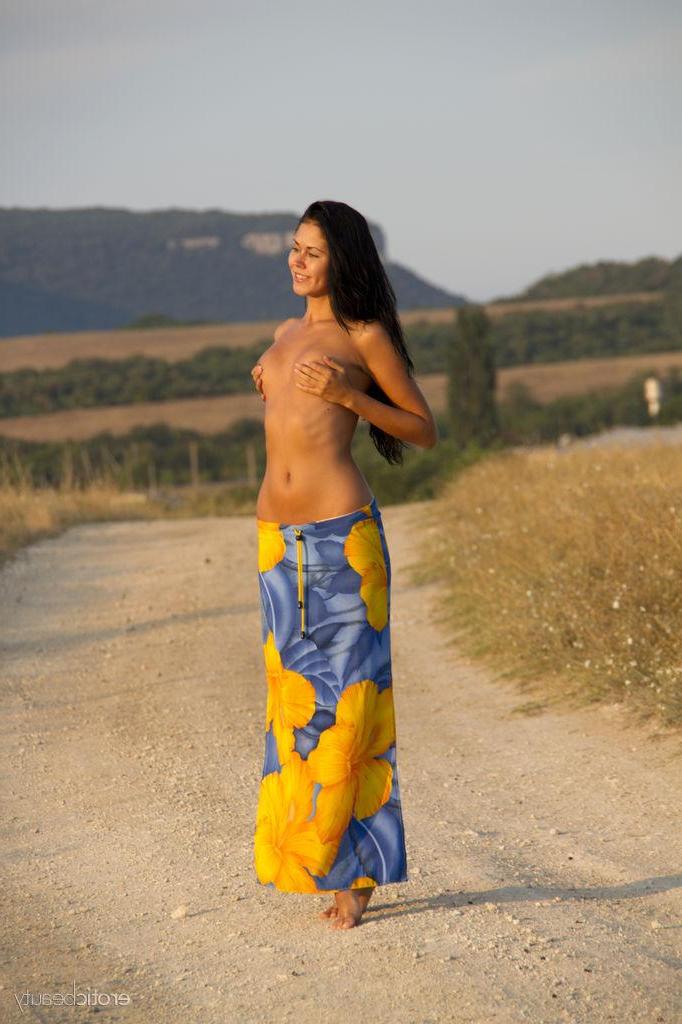 16P Brunette beauty Macy B strips completely naked on an open road