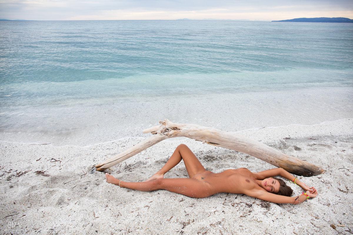 16P Teen hottie Masha E gets naked and spreads her legs on the beach in "Pebbles"