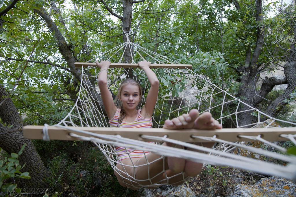 12P Blue-eyed cutie Milena D playfully poses on a hammock