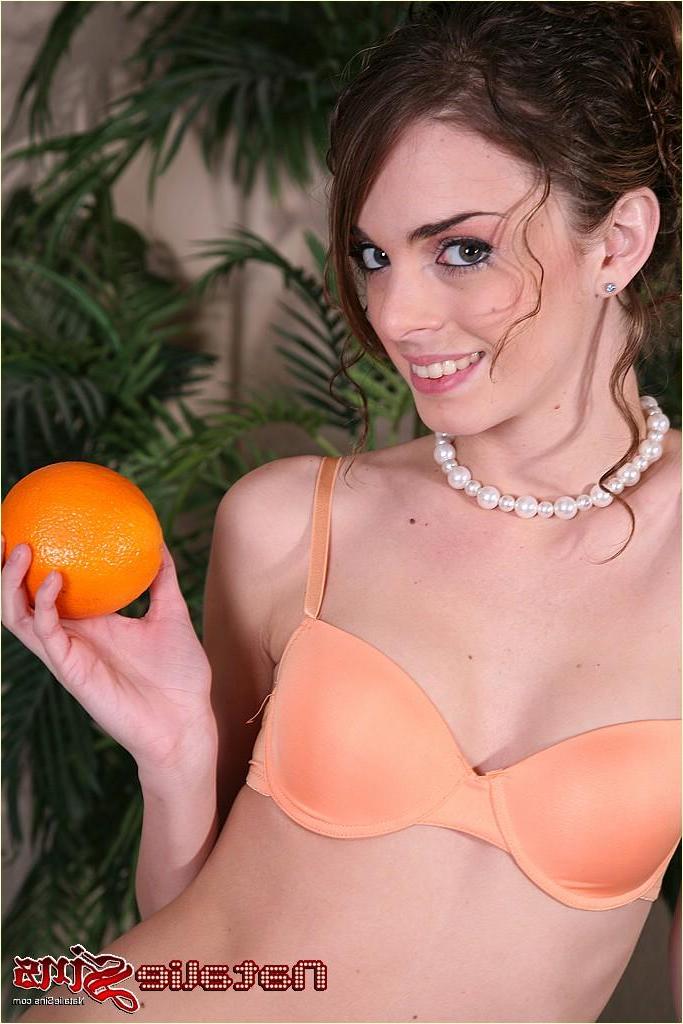 20P Pictures of Natalie Sins getting kinky with an orange