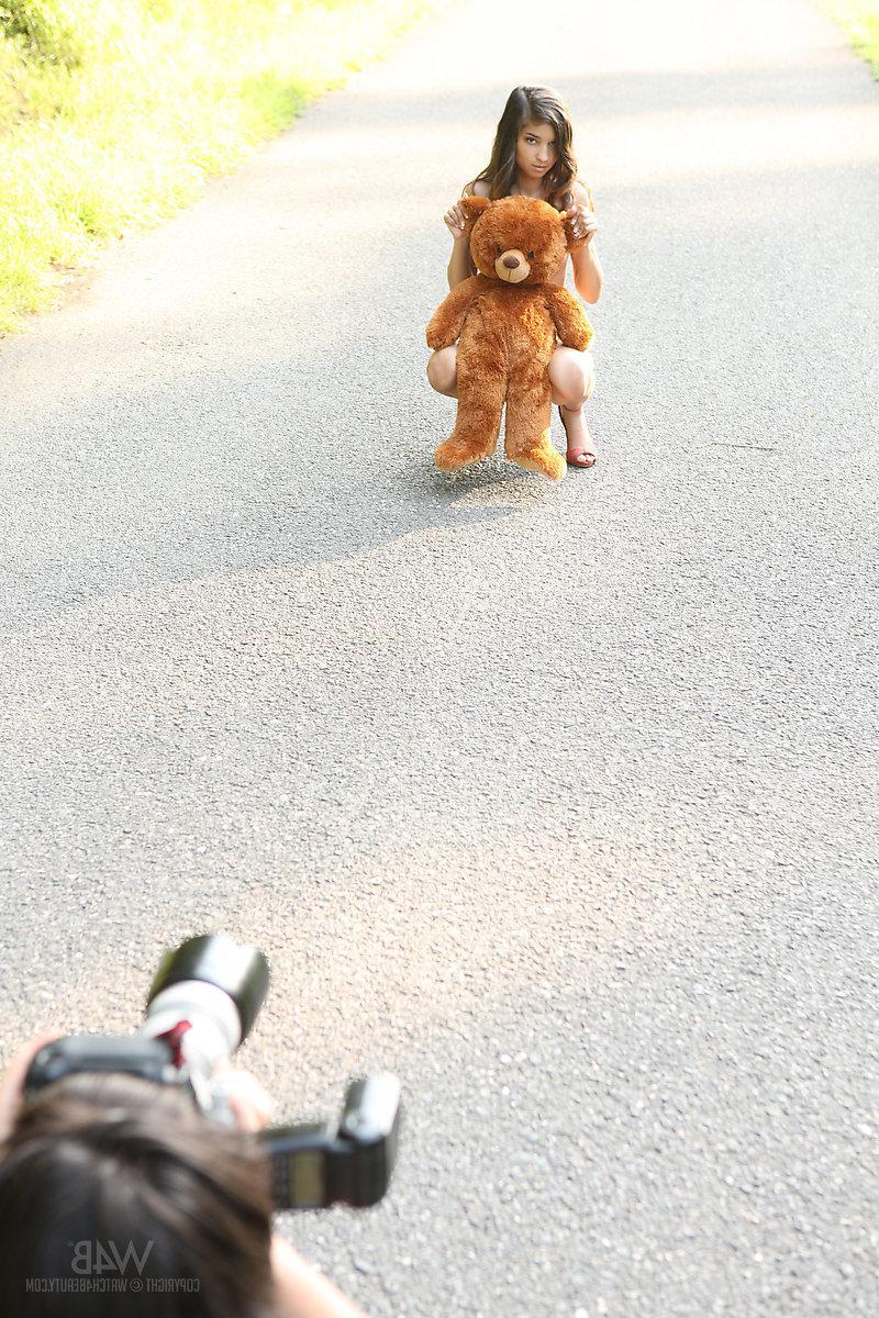 16P Brunette model Nika gives a suggestive set in public with a teddy bear