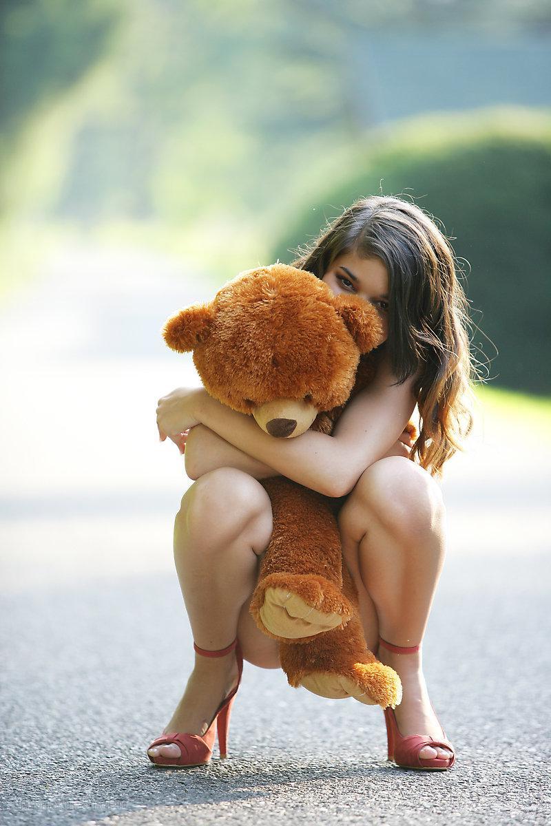 16P Brunette model Nika gives a suggestive set in public with a teddy bear