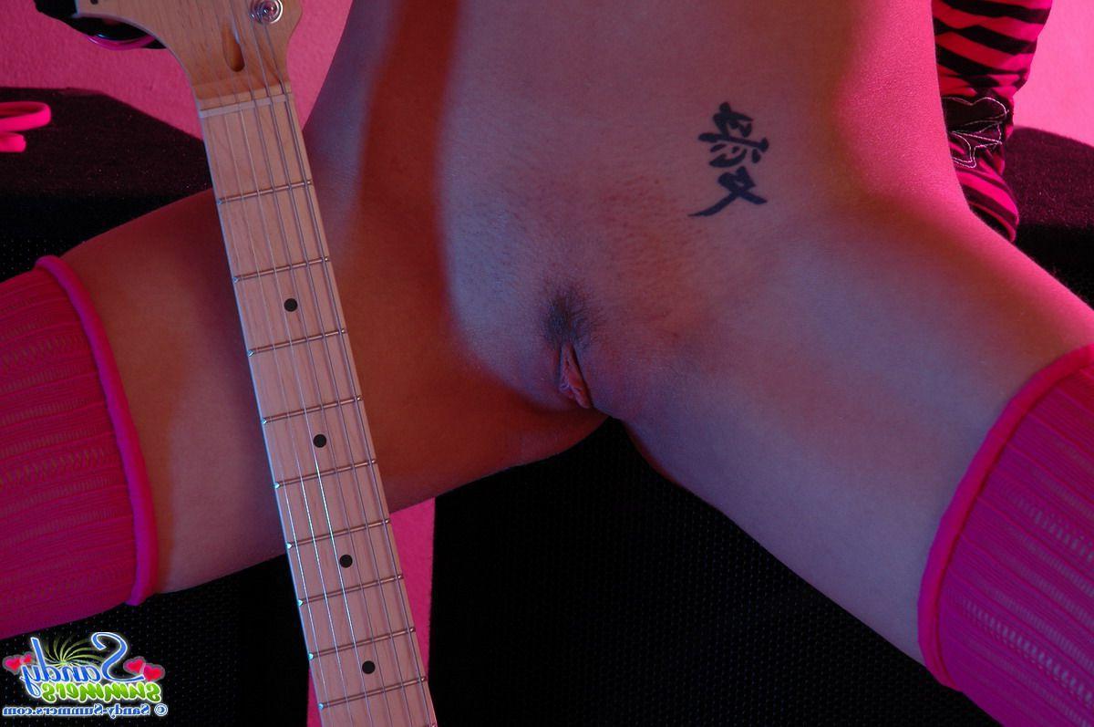 20P Pictures of Sandy Summers playing with something hard