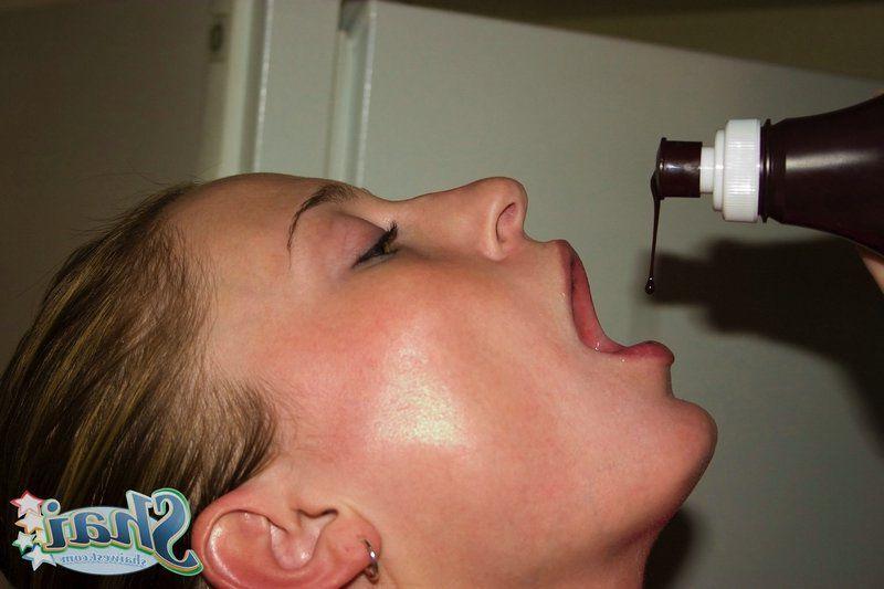14P Pictures of teen babe Shai West being naughty with the chocolate syrup