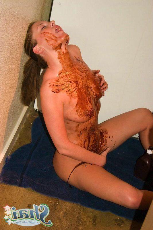 14P Pictures of teen babe Shai West being naughty with the chocolate syrup