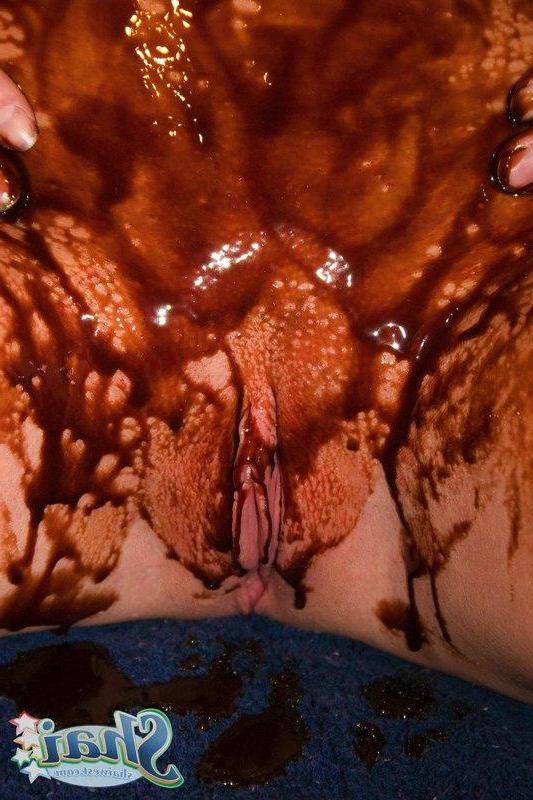 16P Pictures of teen chick Shai West making a mess with chocolate