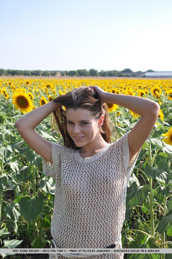 18P 18-year-old Valeria flaunts her youthful beauty and fresh assets amidst a sunflower field.