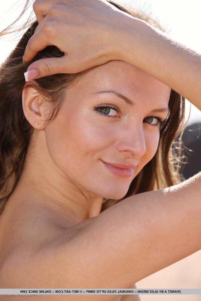 18P Pictures of teen beauty Zhanet A having some naked fun in the sand
