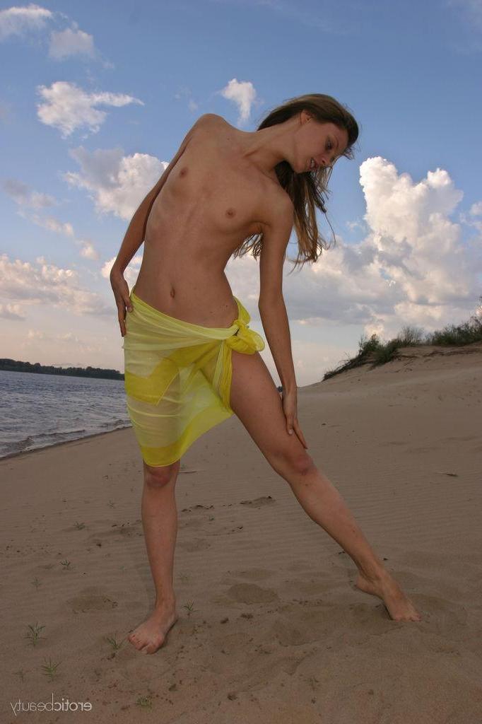 16P Brunette cutie Kate F strips naked on the beach