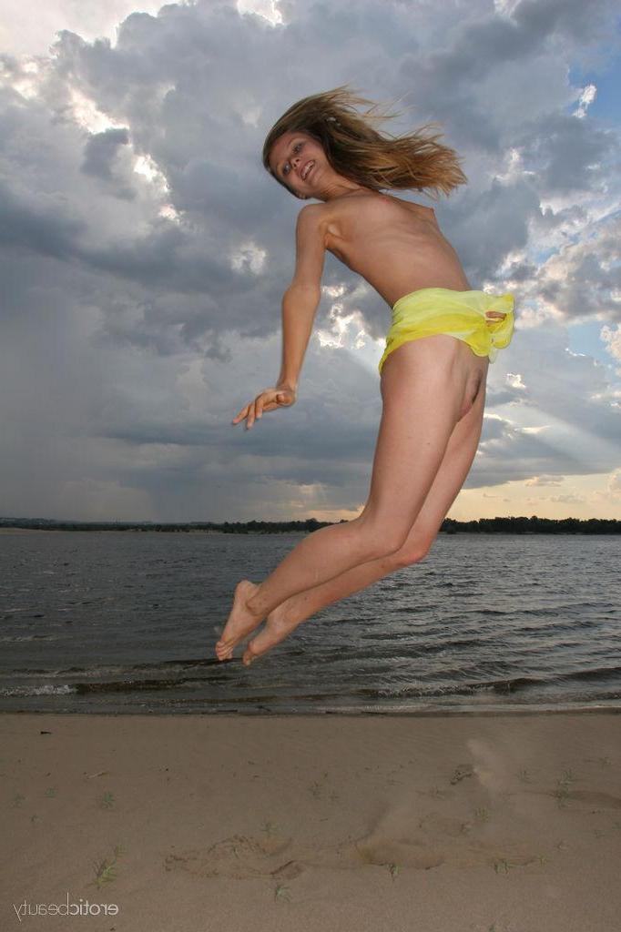 16P Brunette cutie Kate F strips naked on the beach