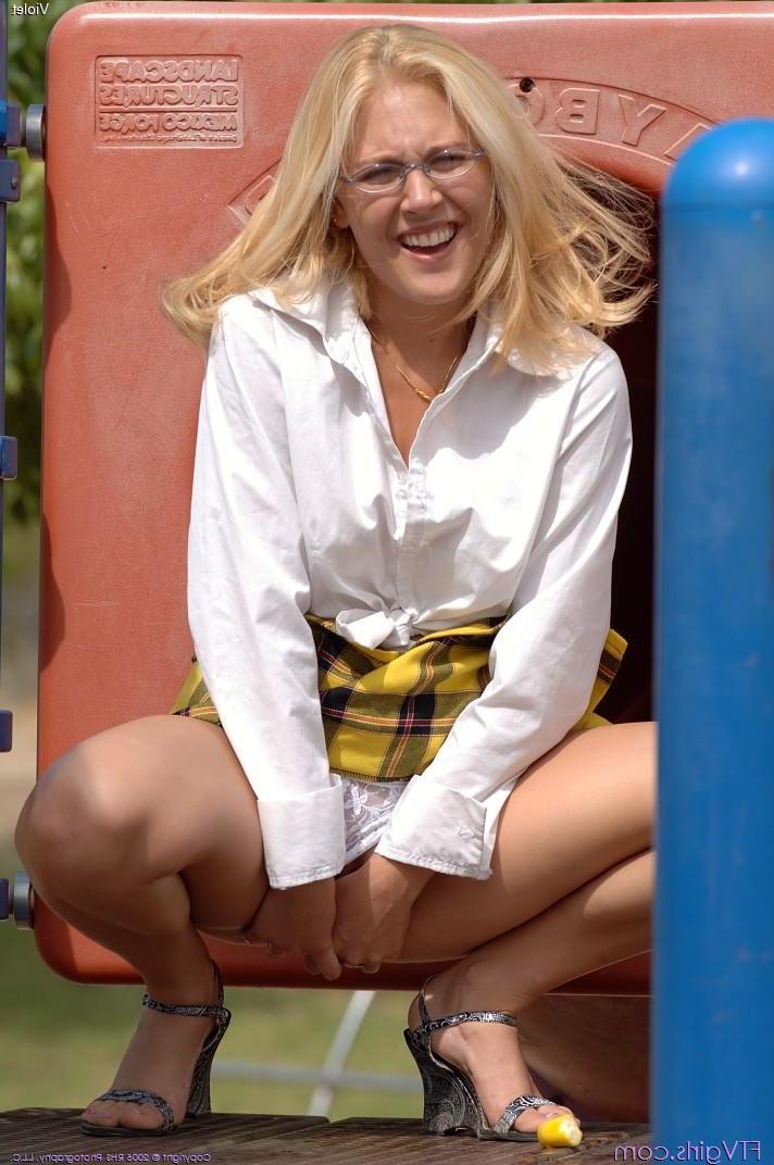 20P Pictures of a blonde schoolgirl toying her pussy in a park