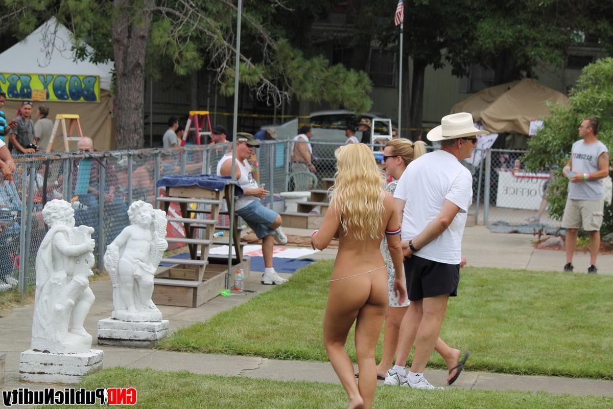 12P Pictures of girls flashing the camera at a public nudity party outdoors