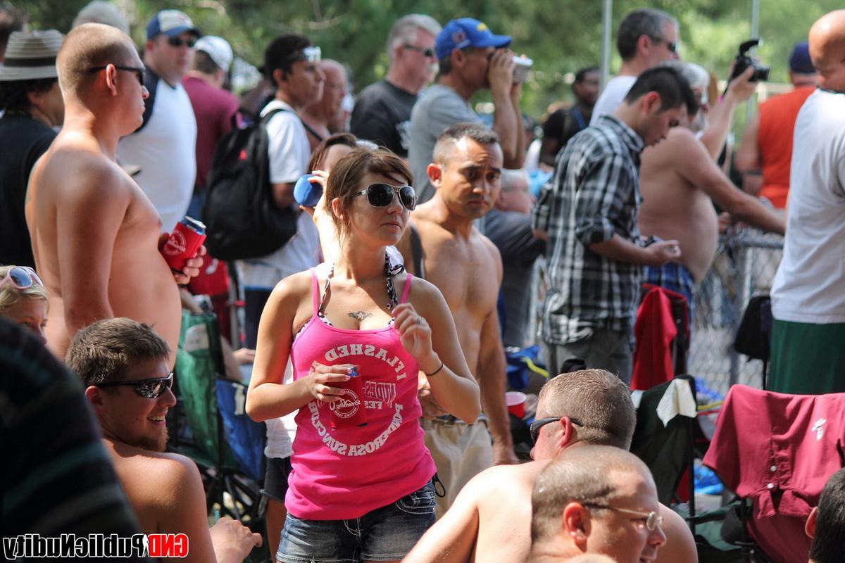 12P Strippers showing off their skills on the pole at an outdoor party