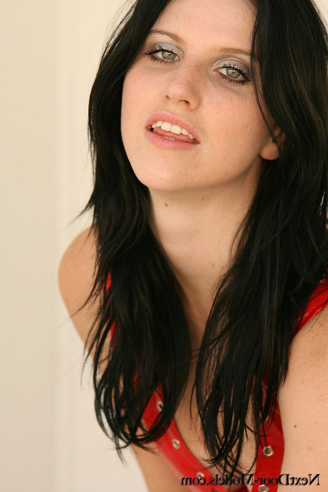 13P Pictures of a brunette beauty teasing in a red dress