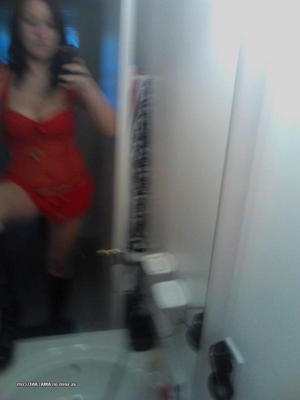 15P Horny brunette babe shows her breasts and pussy