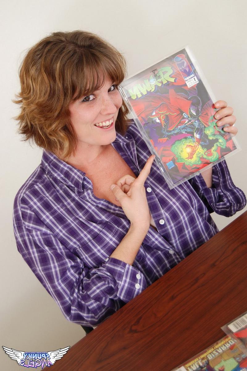 12P Misty exposes her natural big tits as she shows off her comic book collection