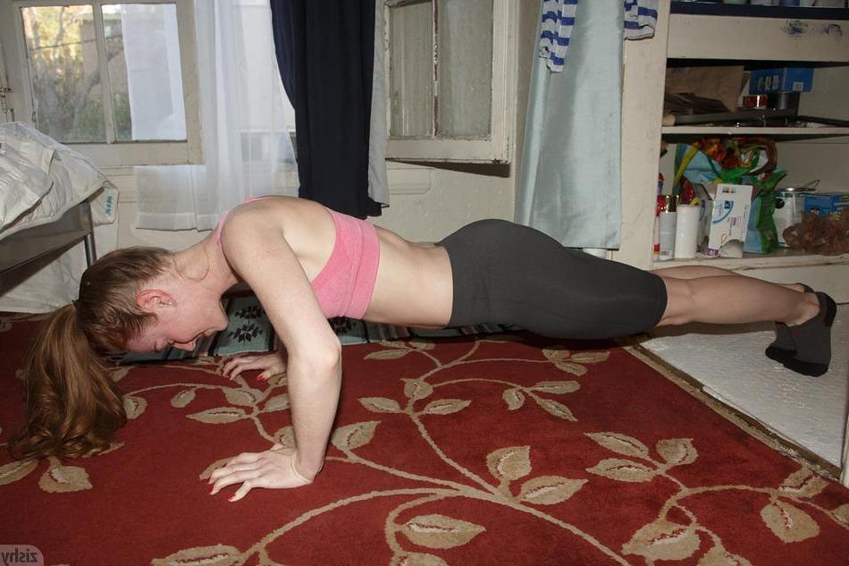 8P Hot redhead teen Julie Wheeler shows off how flexible she is