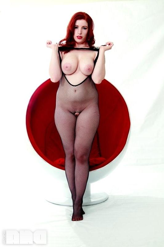 15P Busty redhead pinup Selina Kyl shows off her sexy curves