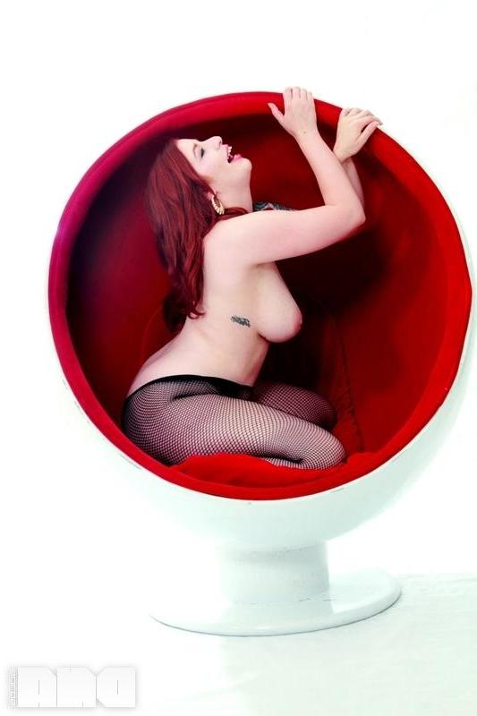 15P Busty redhead pinup Selina Kyl shows off her sexy curves