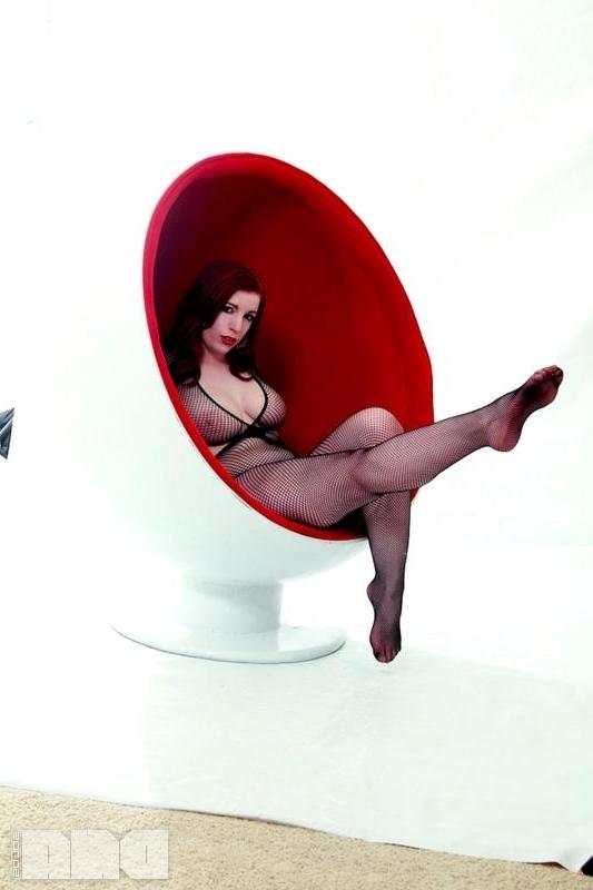 15P Busty redhead pinup Selina Kyl shows off her sexy curves