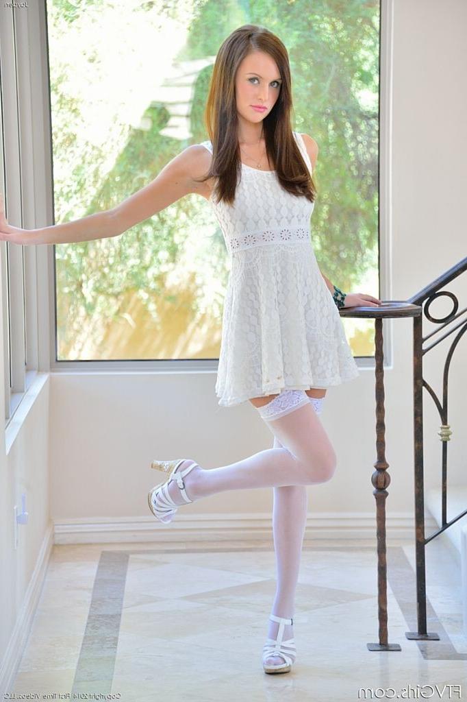 15P Long legged brunette beauty in white stockings and garters