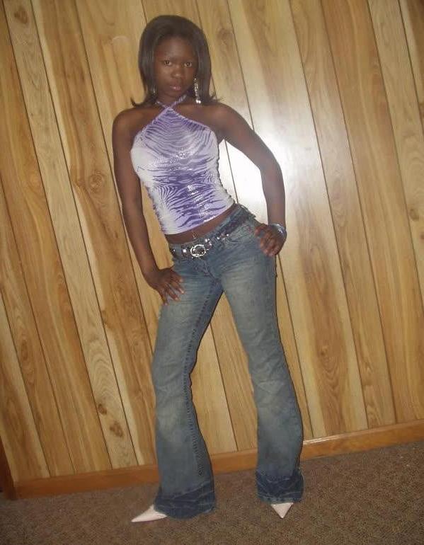 10P Ebony teen chick flaunts tight body while posing in different ou