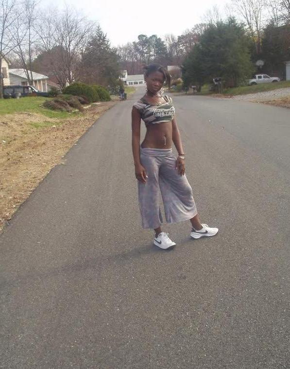 10P Ebony teen chick flaunts tight body while posing in different ou